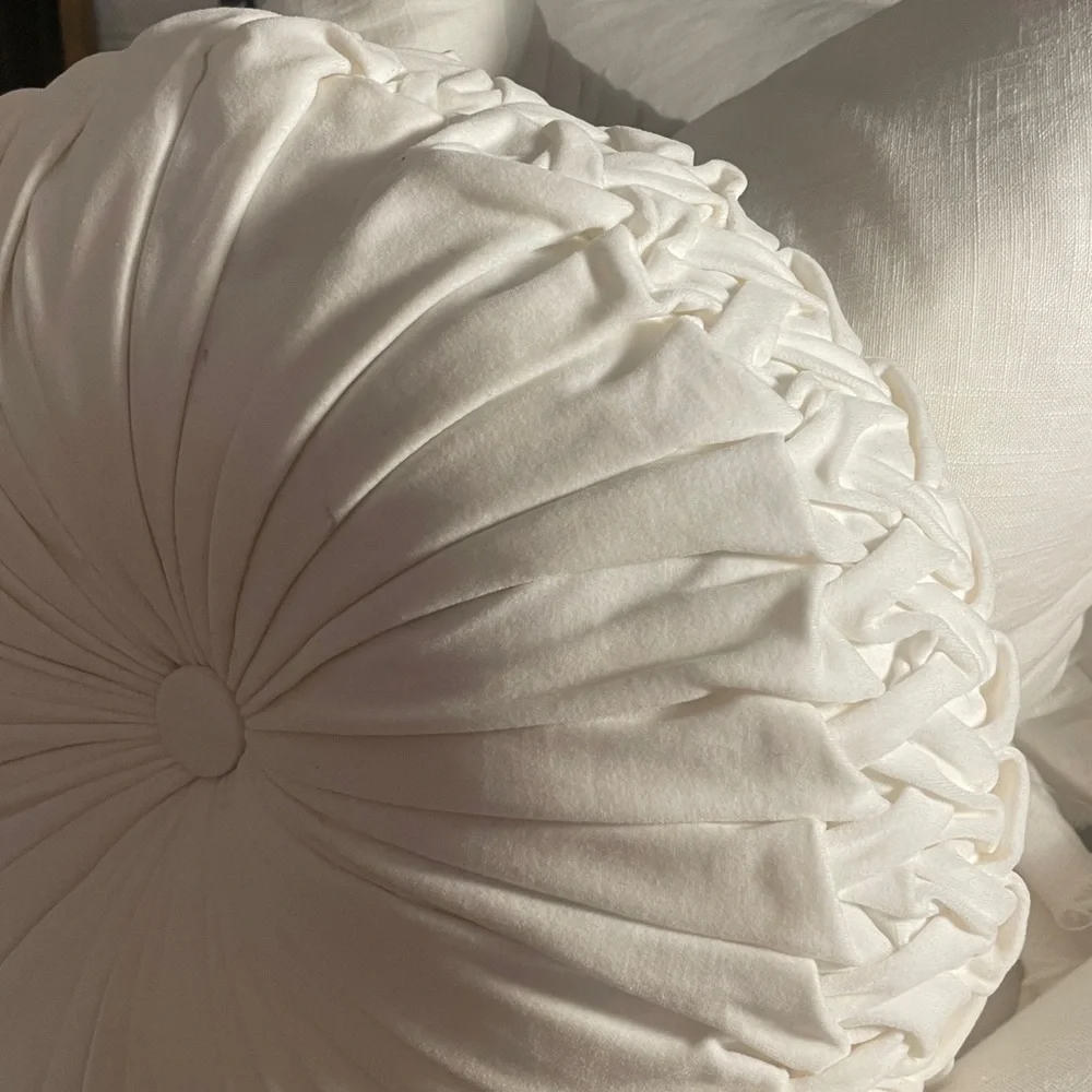 Round white velvet tufted pillow